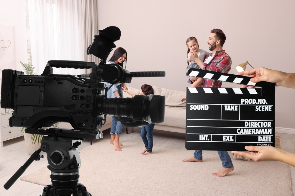 A casting director reviewing headshots and resumes during the actor booking process.