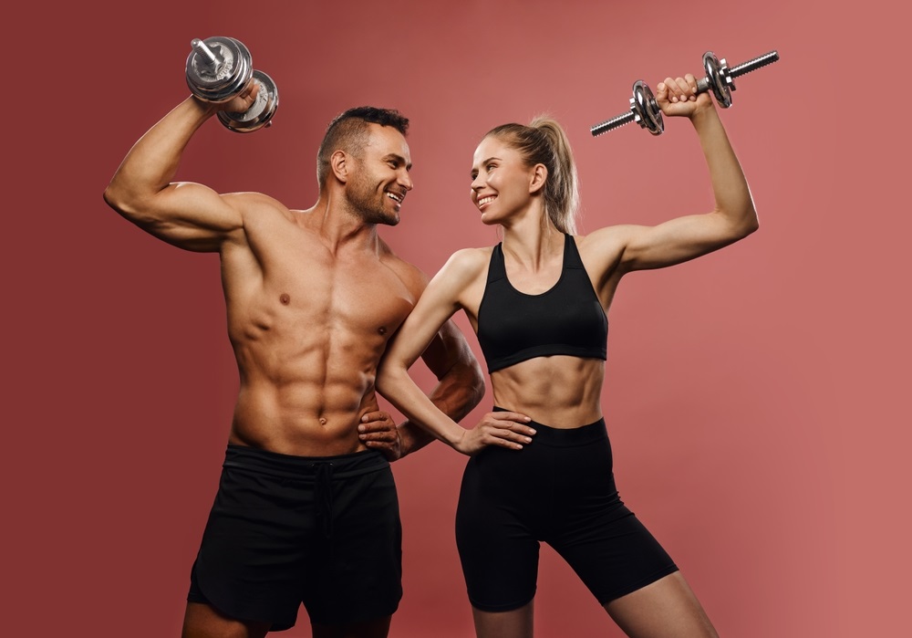 A confident fitness model posing in activewear during a professional photoshoot.