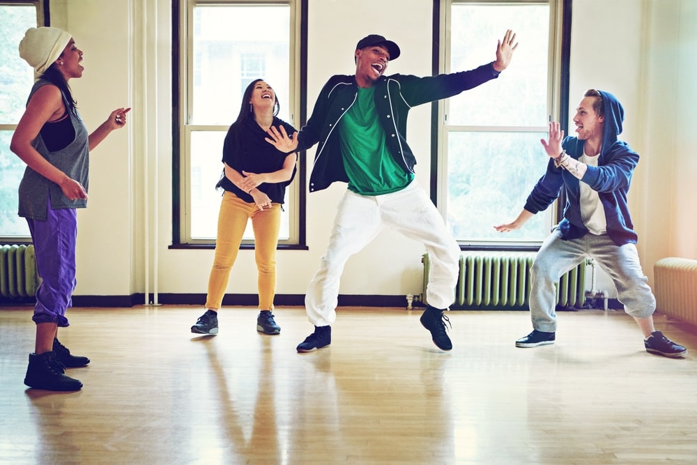 Dancers performing on stage during a professional production.