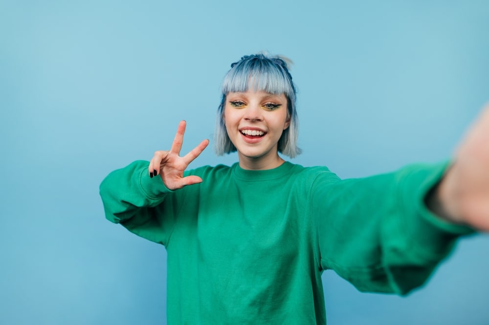 Teenage model posing confidently during a professional photoshoot.