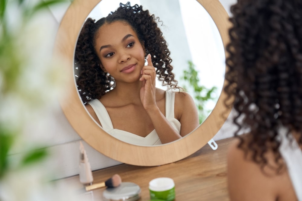 Teenage model posing confidently during a professional photoshoot.