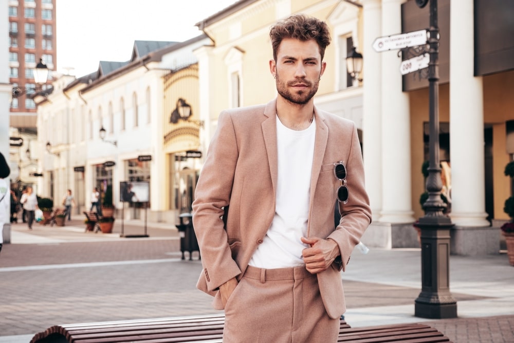 Male model posing confidently during a professional photoshoot.