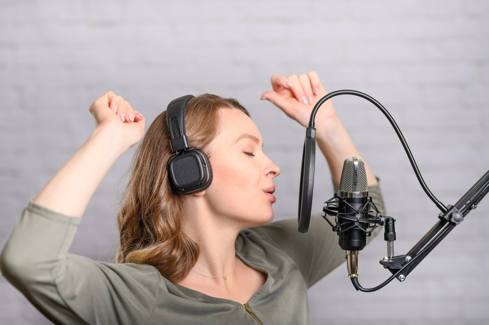 Voice actor recording in a studio for a voice acting position.