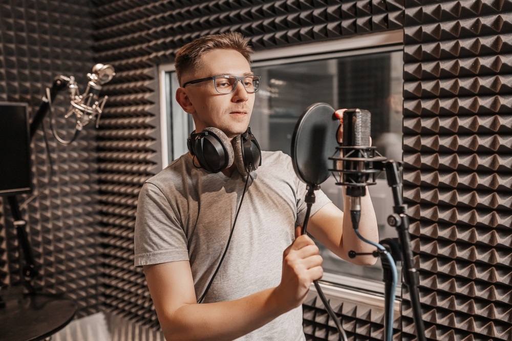 Voice actor recording in a studio for a voice acting position.