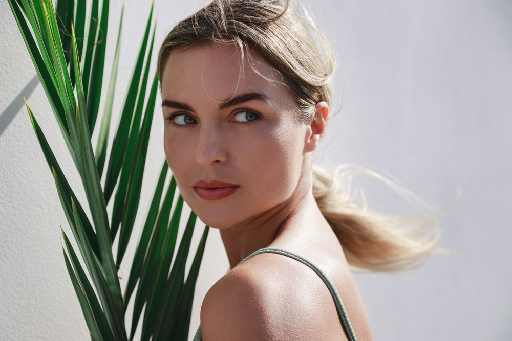 A diverse group of models posing in elegant, modest attire at a professional photo shoot.